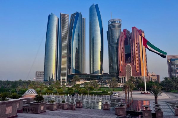 Captivating view of Abu Dhabi's iconic Etihad Towers and cityscape at sunset.